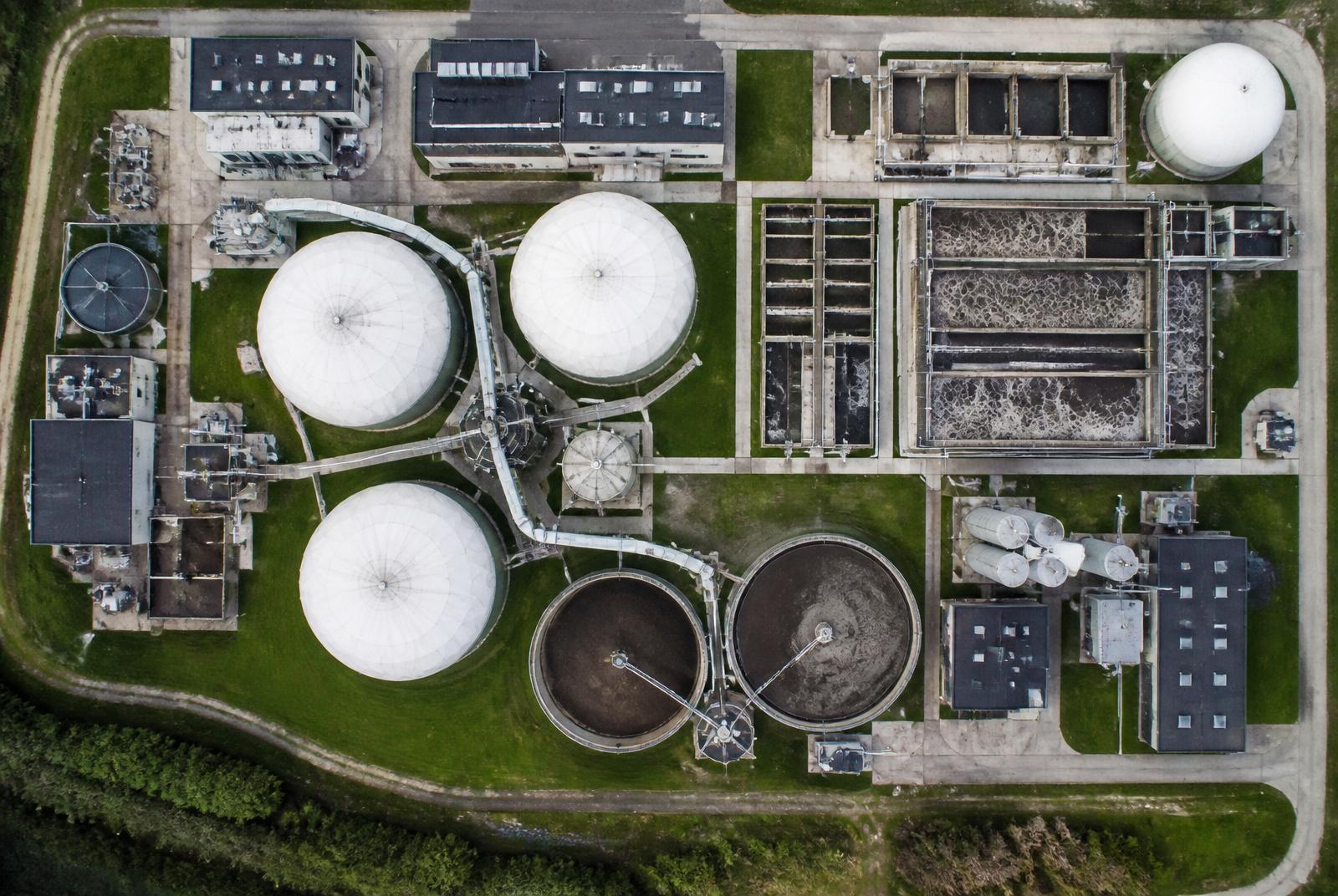 Green domed anaerobic digester tanks at a biogas facility